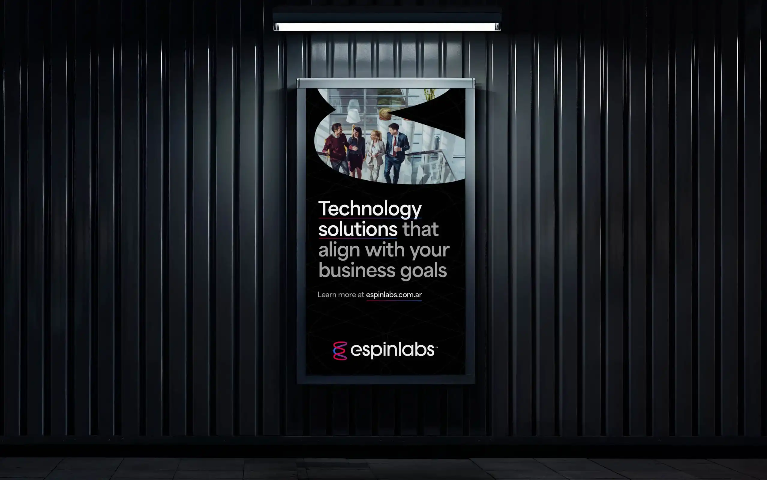 Espinlabs illuminated campaign poster in a dark interior