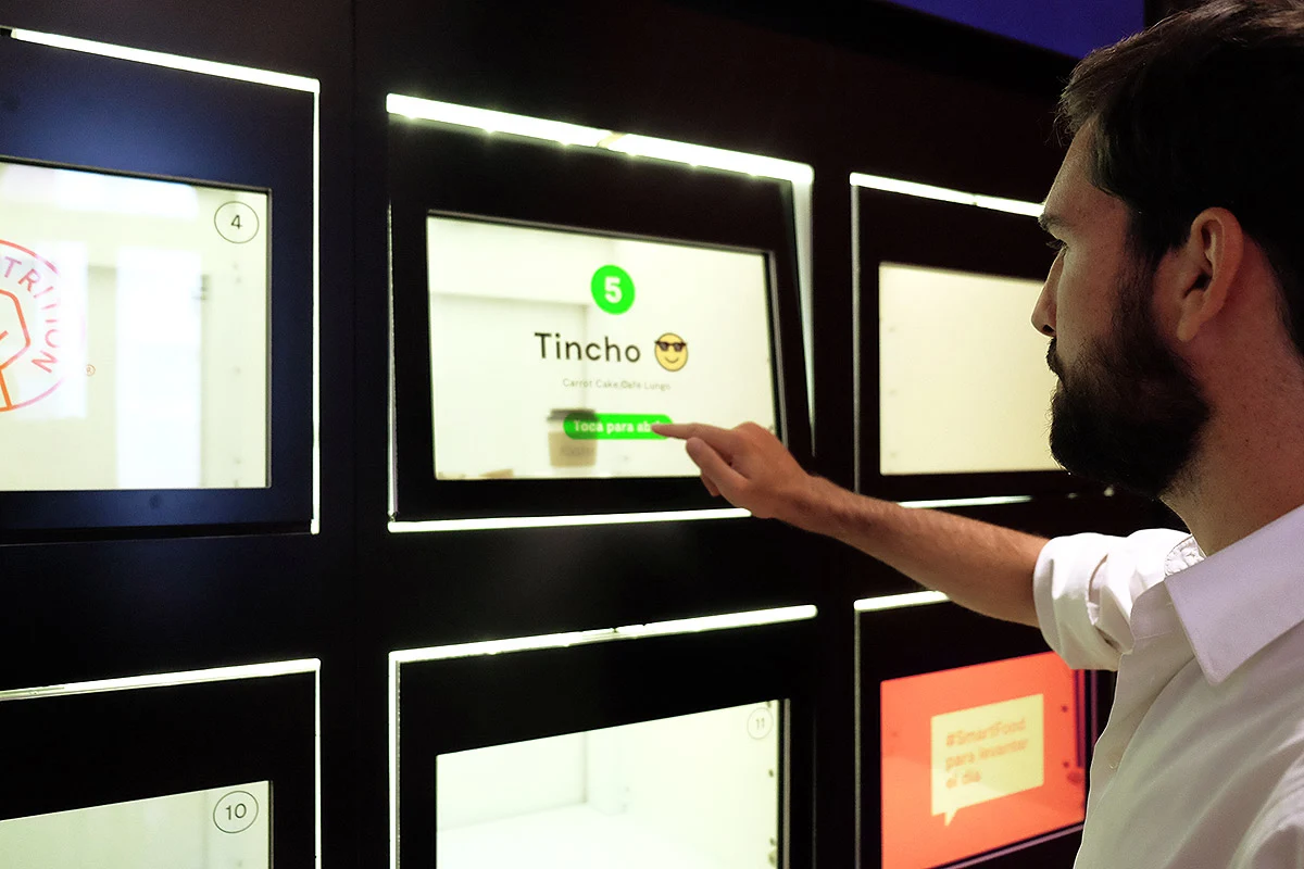 Person using Fōster Nutrition self-service ordering screens